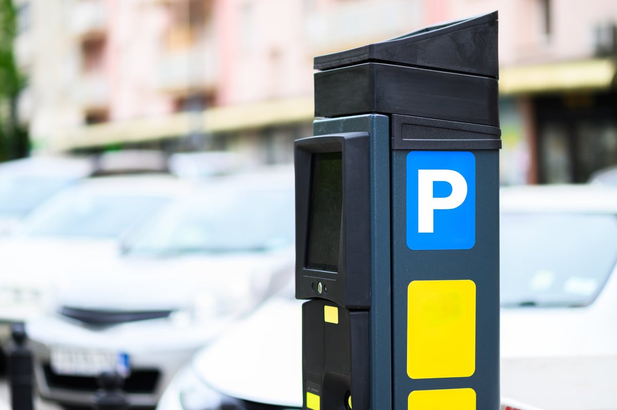 Modern parking meter in urban environment